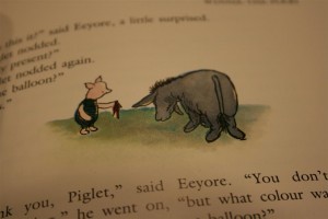 Piglet gives damp rag to Eeyore