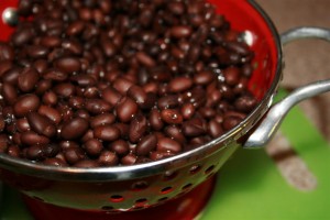black beans in red colander