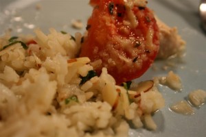 almond rice pilaf with tomato topped chicken