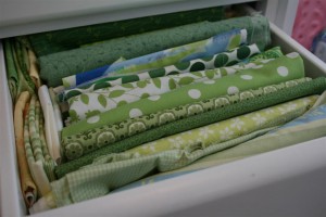 drawer filled with green fabrics
