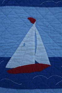 applique sailboats on vintage quilt