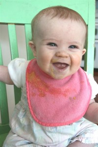 baby with baby food on face