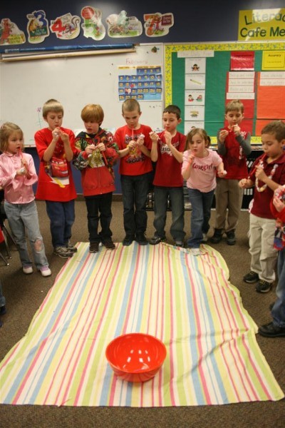 kids playing cupid's arrow game