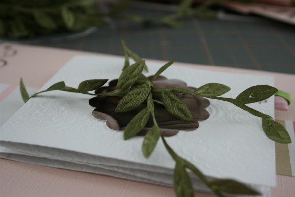 olive leaves tied around paper