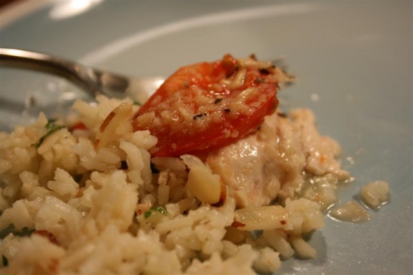 almond rice pilaf with tomato topped chicken