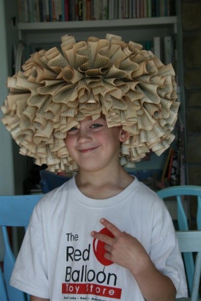 boy wearing book wreath