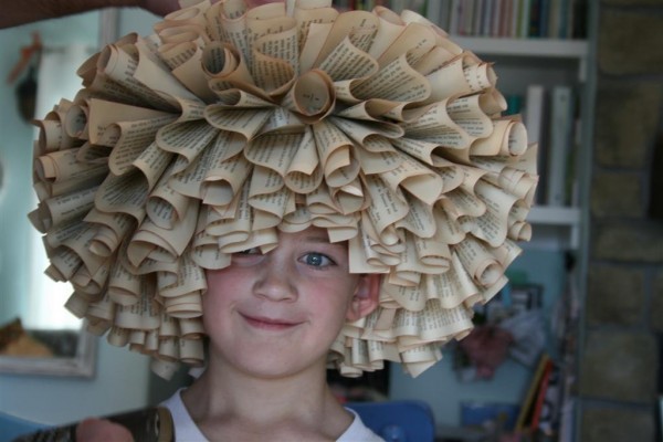 boy wearing book wreath