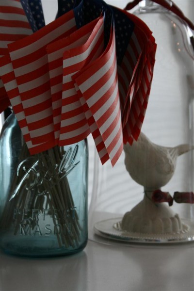 vintage blue jar with old paper flags