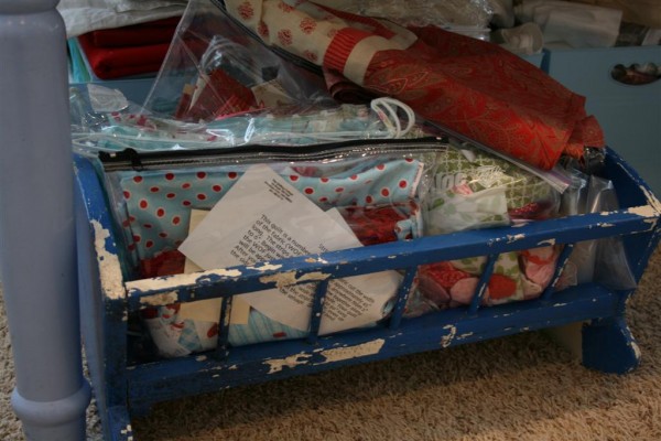 doll cradle with fabric in it