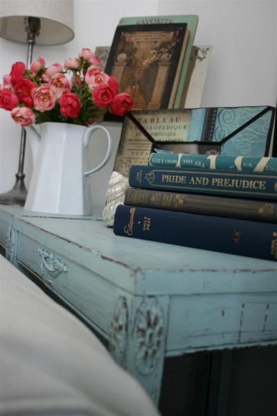 blue tables with books and flowers