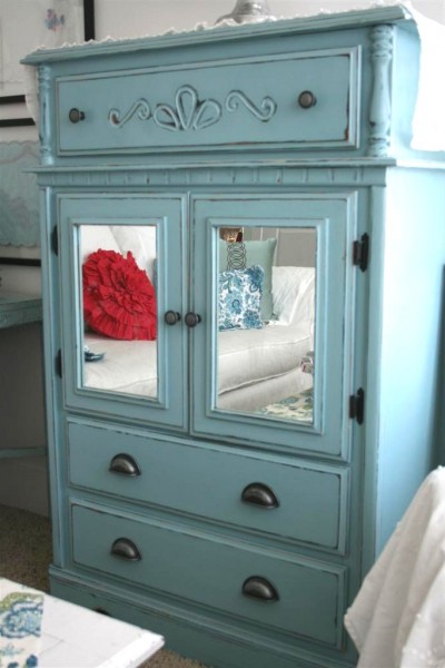 blue dresser with mirrors