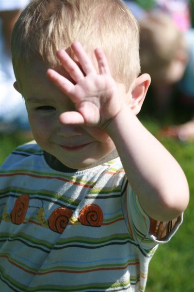 boy blocking sun